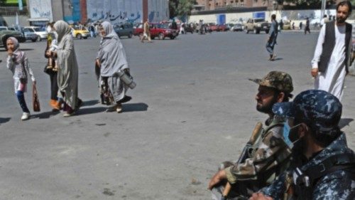 Taliban fighters stand guard along a street in Kabul on September 9, 2021. (Photo by Aamir QURESHI / ...