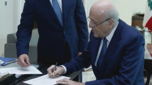 Lebanon's Prime Minister Najib Mikati signs a decree for the formation of the new Lebanese ...