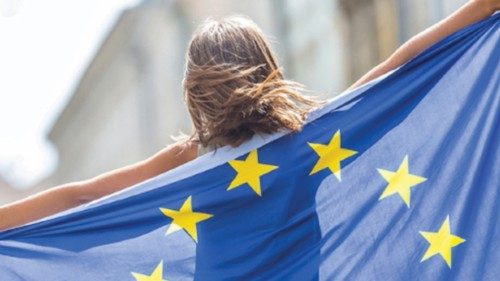 EU Flag. Cute happy girl with the flag of the European Union. Young teenage girl waving with the ...