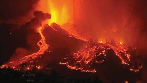 Lava pours out of a volcano in the Cumbre Vieja national park at El Paso, on the Canary Island of La ...