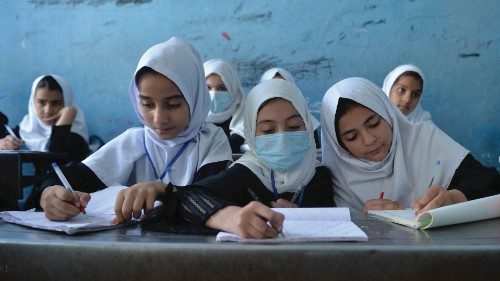 TOPSHOT - This picture taken on September 20, 2021, shows young female students attending a class at ... TOPSHOT - This picture taken on September 20, 2021, shows young female students attending a class at ...