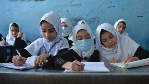 TOPSHOT - This picture taken on September 20, 2021, shows young female students attending a class at ...