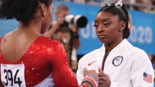 Simone Biles talks with Jordan Chiles of Team United States during the Women's Team Final on day ...