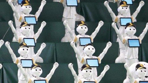 epa09472570 Humanoid robots Pepper perform to support the Fukuoka SoftBank Hawks baseball team in ...