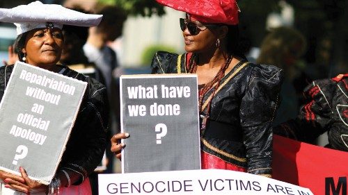 FILE PHOTO: People protest outside a ceremony in Berlin, Germany, August 29, 2018, to hand back ...