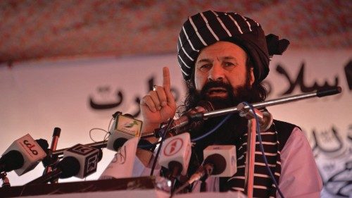 Khalil Haqqani, Taliban's new minister for refugees speaks during an open-air rally in a field on ...