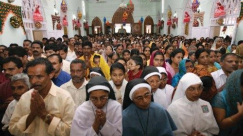 Thousands of devotees of Sister Alphonsa pray at Sister Alphonsa's tomb at a special holy mass ...