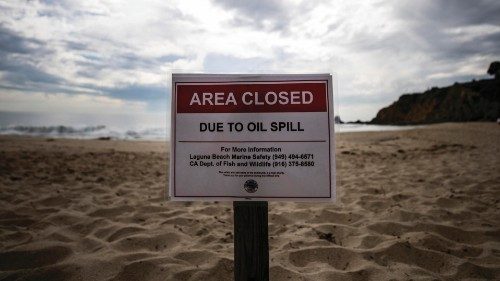 epa09506323 A sign on Crescent Beach read 'Area Closed Due to Oil Spill' after an oil spill off the ...