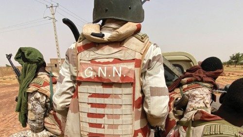A convoy of Nigerien soldiers patrol outside the town of Ouallam, Niger, July 6, 2021. Picture taken ...