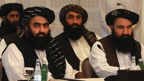 CORRECTION / Members of the Taliban delegation Shahabuddin Delawar (L), Amir Khan Muttaqi, and ...