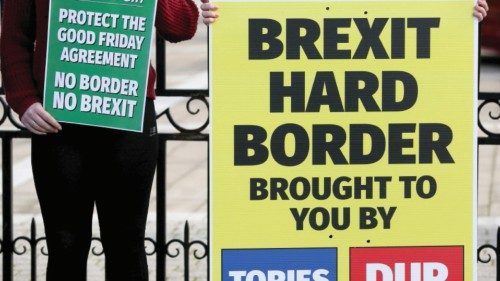 (FILES) In this file photo taken on October 17, 2018 Students hold up Sinn Fein anti-Brexit placards ... (FILES) In this file photo taken on October 17, 2018 Students hold up Sinn Fein anti-Brexit placards ...