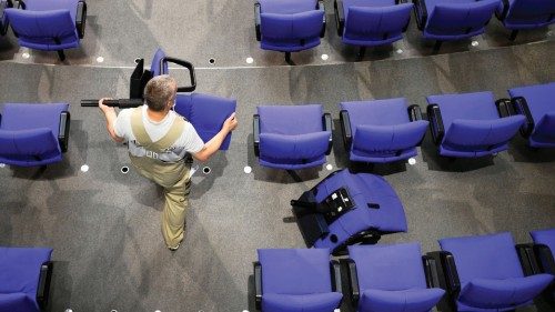 A worker prepares the plenary hall of the German lower house of Parliament, the Bundestag, for the ...