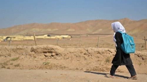 An Afghan girl returns to her home after attending school in Chashma Dozak area of Badghis province ...