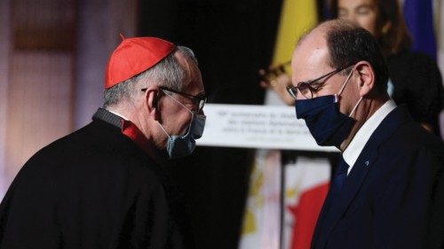 French Prime Minister Jean Castex (R) talks with Vatican's Secretary of State, Italian Cardinal ...