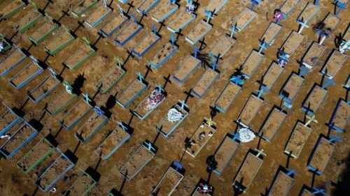 (FILES) In this file photo taken on April 15, 2021 aerial view of graves of COVID-19 victims at the ... (FILES) In this file photo taken on April 15, 2021 aerial view of graves of COVID-19 victims at the ...