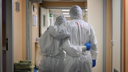 (FILES) In this file photo taken on April 20, 2020 Doctor Marco (R) and nurse Manu, wearing ... (FILES) In this file photo taken on April 20, 2020 Doctor Marco (R) and nurse Manu, wearing ...