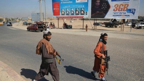 Taliban members guard as they walk along a road in Guzara district of Herat province on October 20, ...