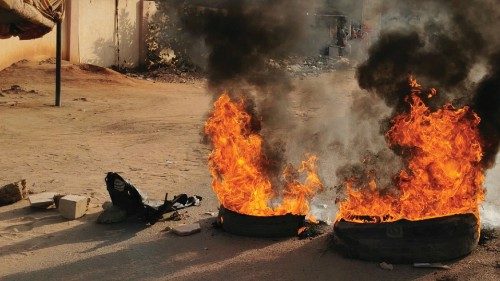 A road barricade is set on fire during what the information ministry calls a military coup in ... A road barricade is set on fire during what the information ministry calls a military coup in ...