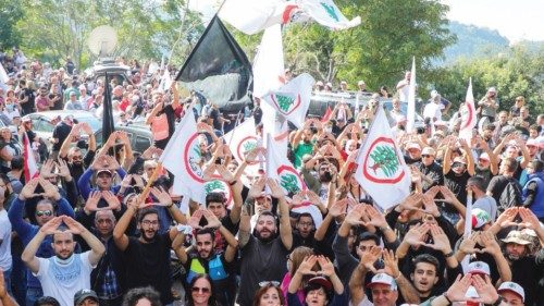 Supporters of the Christian Lebanese Forces party gesture during a protest against the summoning of ... Supporters of the Christian Lebanese Forces party gesture during a protest against the summoning of ...