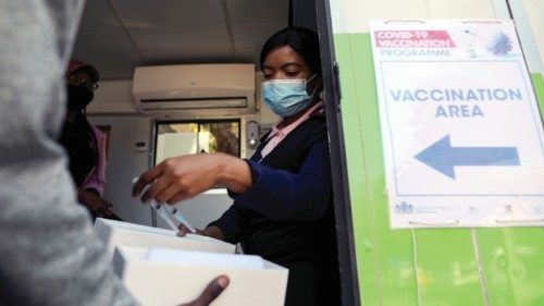 FILE PHOTO: A healthcare worker receives syringes filled with the Johnson and Johnson coronavirus ... FILE PHOTO: A healthcare worker receives syringes filled with the Johnson and Johnson coronavirus ...