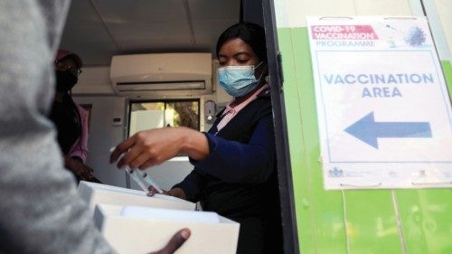 FILE PHOTO: A healthcare worker receives syringes filled with the Johnson and Johnson coronavirus ...