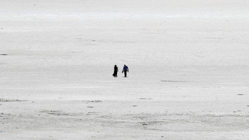 Tourists visit the dried-up Tuz Golu (Salt Lake), about 130 km (81 miles) from Ankara, on August 26, ...