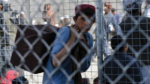 A boy waits to cross into Pakistan at the Afghanistan-Pakistan border crossing point in Spin Boldak ...