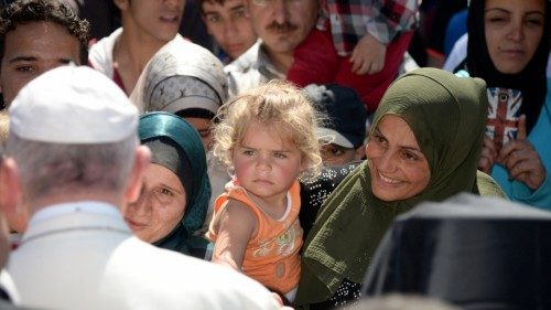 Pope Francis greets migrants and refugees at the Moria refugee camp on April 16, 2016 near the port ...