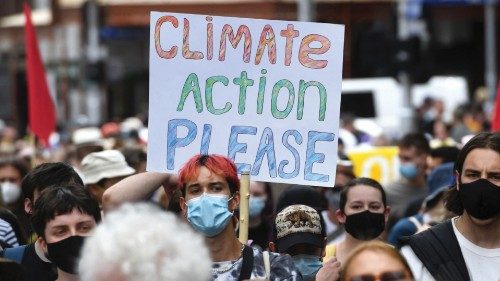 People participate in a rally during a global day of action on climate change in Melbourne on ...