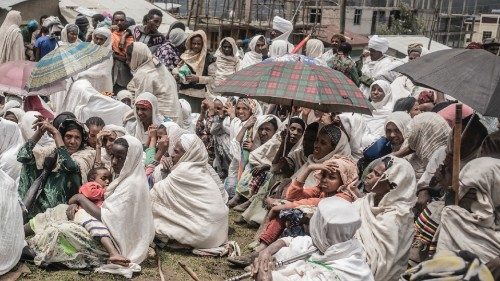 People who fled the war from May Tsemre, Addi Arkay and Zarima gather around in a temporarily built ...