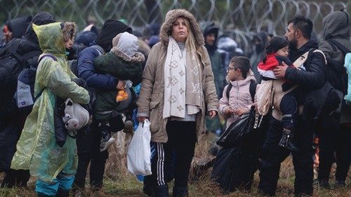 TOPSHOT - A picture taken on November 8, 2021 shows migrants at the Belarusian-Polish border in the ...