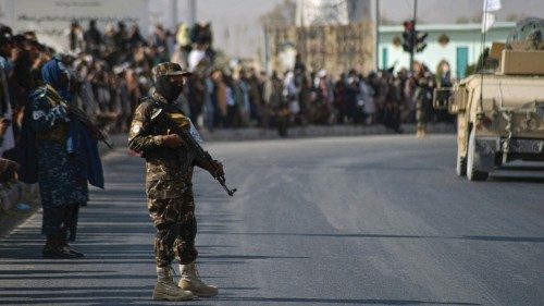 People watch a Taliban military parade of the Al-Badr unit in Kandahar on November 8, 2021. (Photo ... People watch a Taliban military parade of the Al-Badr unit in Kandahar on November 8, 2021. (Photo ...