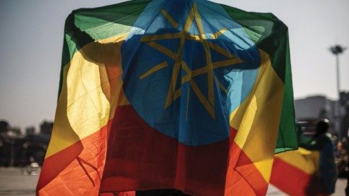 TOPSHOT - A man covers himself with an Ethiopian flag during a rally in Addis Ababa, Ethiopia, on ... TOPSHOT - A man covers himself with an Ethiopian flag during a rally in Addis Ababa, Ethiopia, on ...
