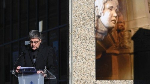 Archibshop of Reims Eric de Moulins-Beaufort speaks past an artwork, made by a victim, dedicated to ...