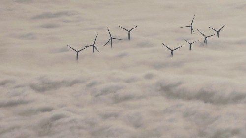 TOPSHOT - Wind turbine are seen over the clouds on November 10, 2021 in Chatellerault, western ... TOPSHOT - Wind turbine are seen over the clouds on November 10, 2021 in Chatellerault, western ...