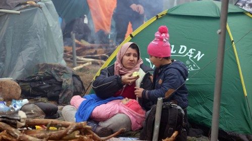 Migrant are seen next to a tent on the Belarusian-Polish border in the Grodno region, Belarus ...