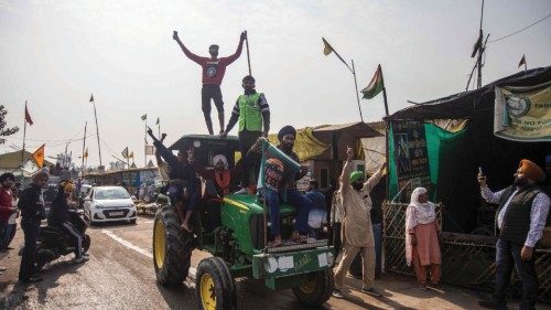 Farmers celebrate after India's Prime Minister announced to repeal three agricultural reform laws ...