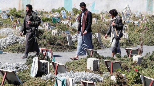 epa09585734 Armed Yemenis attend the funeral of slain Houthi fighters who were killed in the ...