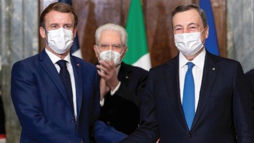 Italian President Sergio Mattarella applauds as Prime Minister Mario Draghi and French President ...