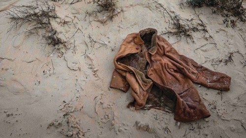 A photo shows a coat left by migrants hiding in the dunes of Wimeraux beach, northern France, before ...