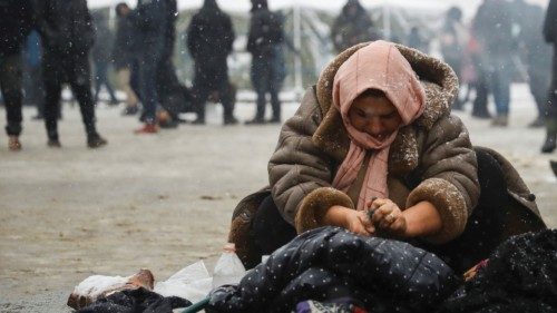 A woman washes clothing near the Belarusian-Polish border, in the Grodno region, Belarus November ...