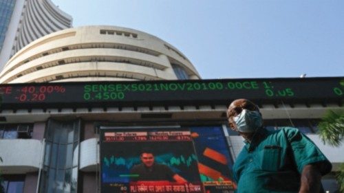 A pedestrian walks past the Bombay Stock Exchange (BSE) building in Mumbai on November 26, 2021. ...