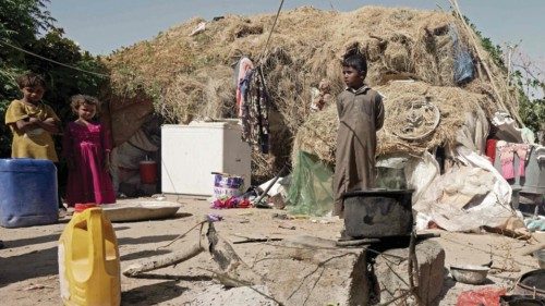 Children stand outside a tent at the al-Sumya camp for internally displaced persons (IDP) east of ...