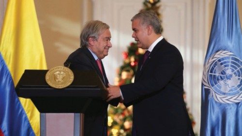 U.N. Secretary General Antonio Guterres is greeted by Colombia's President Ivan Duque before ...