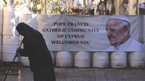 A nun cleans the road in front of the Holy Cross Catholic  Church, where Pope Francis is to conduct ...