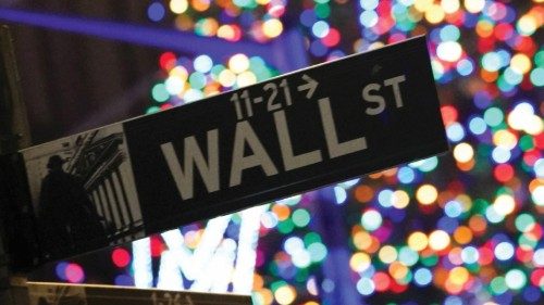 The corner street signs of Wall Street and Broad Street are seen during the 98th Annual Christmas ...