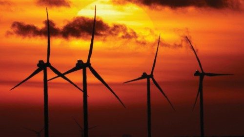 Power-generating windmill turbines are seen during sunset near Bourlon, France, November 29, 2021. ... Power-generating windmill turbines are seen during sunset near Bourlon, France, November 29, 2021. ...