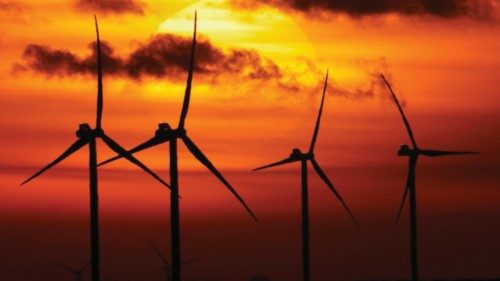 Power-generating windmill turbines are seen during sunset near Bourlon, France, November 29, 2021. ...