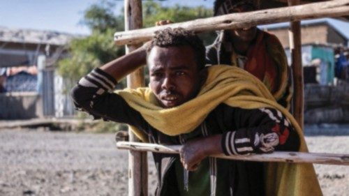 People stand in a shade in Mehal Meda, Ethiopia, on December 06, 2021. (Photo by Amanuel Sileshi / ... People stand in a shade in Mehal Meda, Ethiopia, on December 06, 2021. (Photo by Amanuel Sileshi / ...