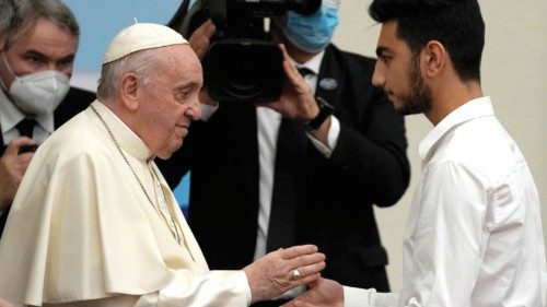 Student Aboud Gabro, 18, with his brother Mario, refugees from Syria, get gifts from Pope Francis ...